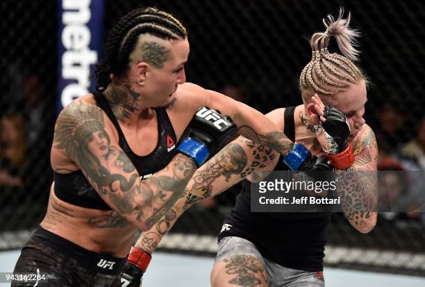 Ashlee Evans-Smith punches Bec Rawlings of Australia in their women's flyweight bout during the UFC 223 event inside Barclays Center on April 7, 2018...