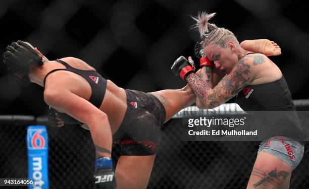 Ashlee Evans-Smith lands a kick on Bec Rawlings during their flyweight bout at UFC 223 at Barclays Center on April 7, 2018 in New York City.