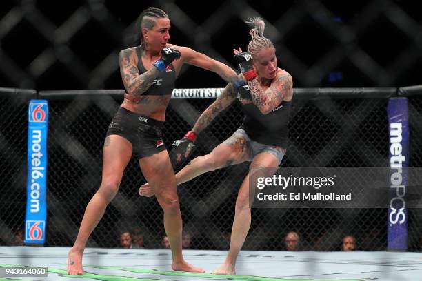 Ashlee Evans-Smith lands a left hand to the head of Bec Rawlings during their flyweight bout at UFC 223 at Barclays Center on April 7, 2018 in New...