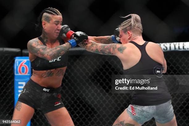 Ashlee Evans-Smith and Bec Rawlings trade punches during their flyweight bout at UFC 223 at Barclays Center on April 7, 2018 in New York City.