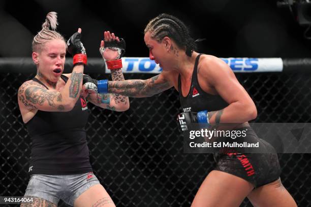 Ashlee Evans-Smith lands a right hand to the head of Bec Rawlings during their flyweight bout at UFC 223 at Barclays Center on April 7, 2018 in New...