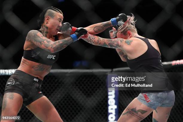 Ashlee Evans-Smith and Bec Rawlings trade punches during their flyweight bout at UFC 223 at Barclays Center on April 7, 2018 in New York City.