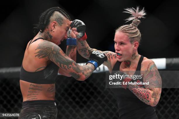 Bec Rawlings lands a right hand to the head of Ashlee Evans-Smith during their flyweight bout at UFC 223 at Barclays Center on April 7, 2018 in New...