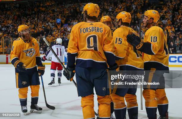 Ryan Ellis of the Nashville Predators celebrates with teammates Filip Forsberg, Craig Smith, and Colton Sissons after a goal against of the Columbus...