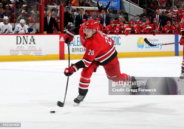 Sebastian Aho of the Carolina Hurricanes shoots the puck during an NHL game against the Tampa Bay Lightning on April 7, 2018 at PNC Arena in Raleigh,...