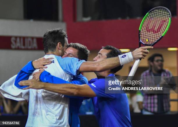 Argentina's tennis player Guido Pella celebraters with teammates after defeating Chile's Christian Garin during their 2018 Davis Cup Americas Group...
