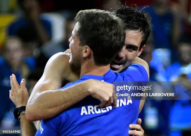 Argentina's tennis player Guido Pella celebrates with teammates after defeating Chile's Christian Garin during their 2018 Davis Cup Americas Group...