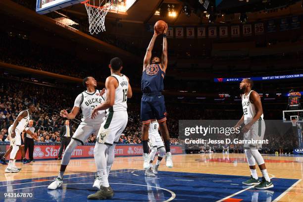 Kyle O'Quinn of the New York Knicks grabs the rebound against the Milwaukee Bucks on April 7, 2018 at Madison Square Garden in New York City, New...