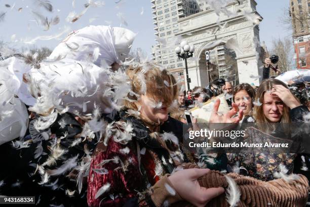 People take part in the Annual Pillow Fight at Washington Square on April 7, 2018 in New York City. The event takes place in over 100 cities around...