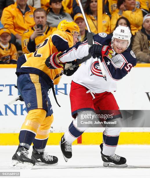 Mark Letestu of the Columbus Blue Jackets battles against Ryan Johansen of the Nashville Predators during an NHL game at Bridgestone Arena on April...