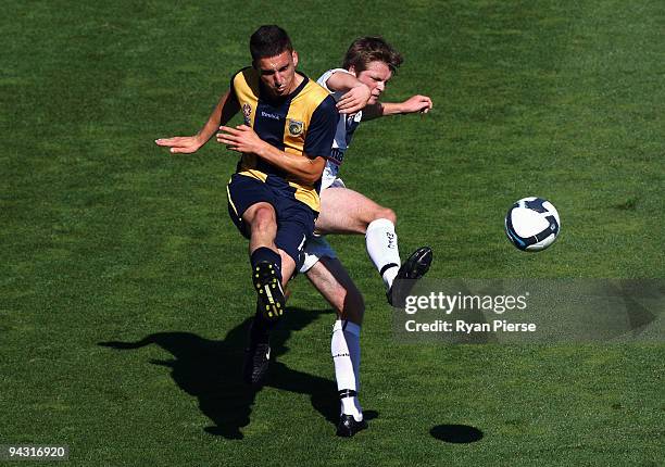 Nikas Panagiotis of the Mariners is tackled by Craig Sweeney of the Victory during the round 14 National Youth League match between the Central Coast...