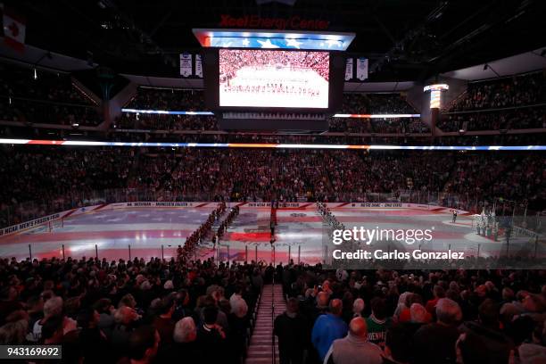 The Notre Dame Fighting Irish take on the University of Minnesota Duluth Bulldogs during the Division I Men's Ice Hockey Semifinals held at the Xcel...