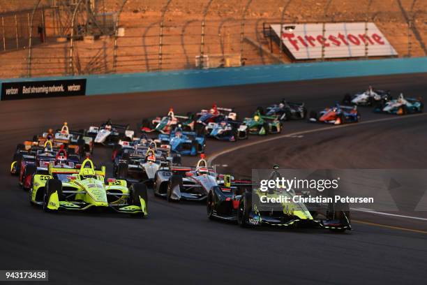 Sebastien Bourdais driver of the Dale Coyne Racing with Vasser-Sullivan Honda IndyCar leads at the start of the Verizon IndyCar Series Phoenix Grand...