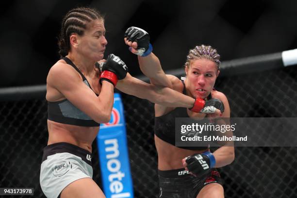 Felice Herrig and Karolina Kowalkiewicz trade punches during their strawweight bout at UFC 223 at Barclays Center on April 7, 2018 in New York City.