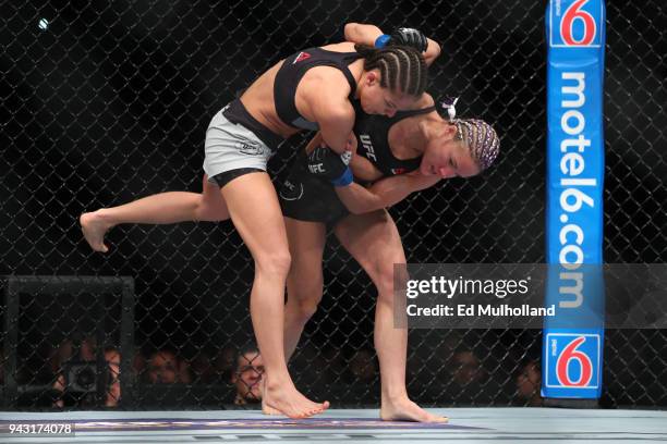Felice Herrig attempts a takedown of Karolina Kowalkiewicz during their strawweight bout at UFC 223 at Barclays Center on April 7, 2018 in New York...