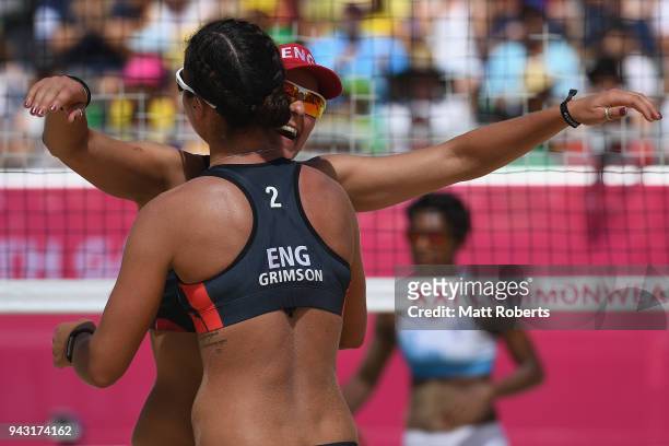 Victoria Palmer and Jessica Grimson of England celebrate victory during the Beach Volleyball Women's Preliminary round against Iliseva Ratudina and...