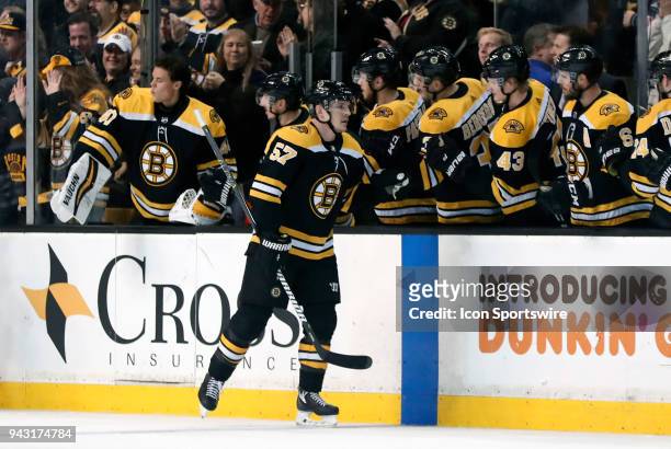 Boston Bruins winger Tommy Wingels skates by the bench after scoring Boston's second goal during a game between the Boston Bruins and the Ottawa...