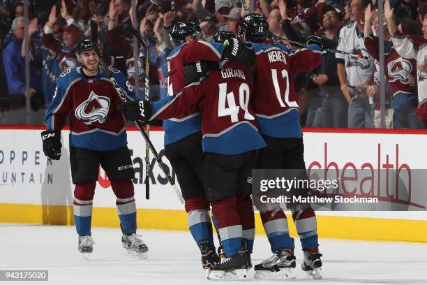 Samuel Girard of the Colorado Avalanche is congratulated by Matt Nieto, Blake Comeau and Patrik Nemeth after scoring a goal against the St Louis...