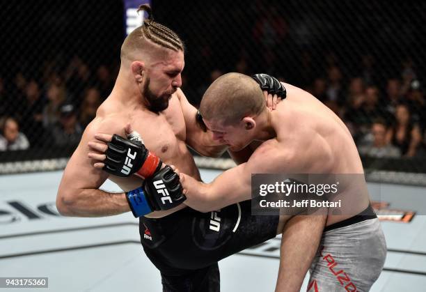 Chris Gruetzemacher knees Joe Lauzon in their lightweight bout during the UFC 223 event inside Barclays Center on April 7, 2018 in Brooklyn, New York.