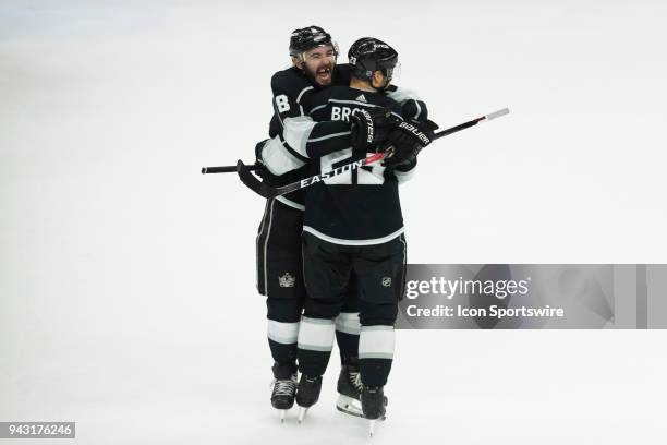 Los Angeles Kings right wing Dustin Brown celebrates his game winning overtime goal with Los Angeles Kings defenseman Drew Doughty during an NHL...