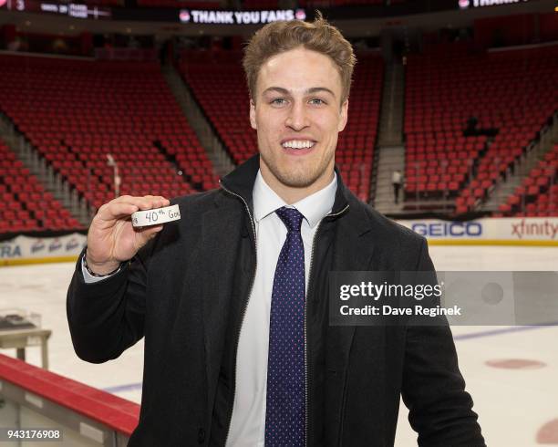 Anders Lee of the New York Islanders poses with his 40th of the season NHL goal puck following an NHL game against the Detroit Red Wings at Little...