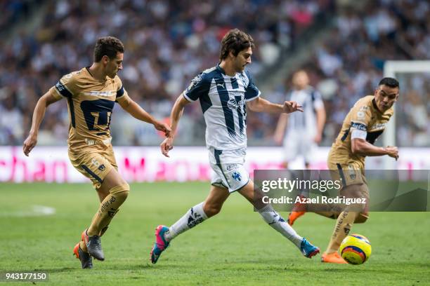 Lucas Albertengo of Monterrey fights for the ball with Kevin Escamilla and Pablo Barrera of Pumas during the 14th round match between Monterrey and...