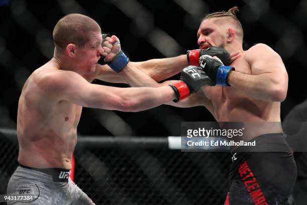 Chris Gruetzemacher and Joe Lauzon trade punches during their lightweight bout at UFC 223 at Barclays Center on April 7, 2018 in New York City.