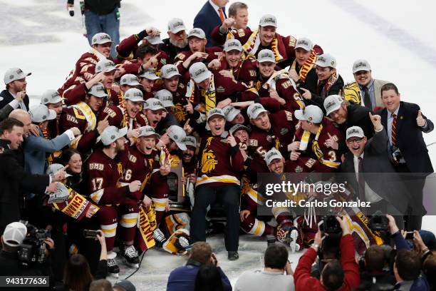 The Minnesota-Duluth Bulldogs celebrate their victory over the Notre Dame Fighting Irish during the Division I Men's Ice Hockey Semifinals held at...