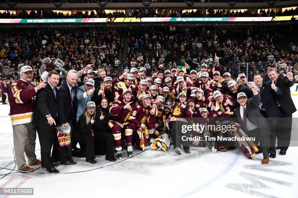 The Minnesota-Duluth Bulldogs celebrate their victory over the Notre Dame Fighting Irish during the Division I Men's Ice Hockey Semifinals held at...