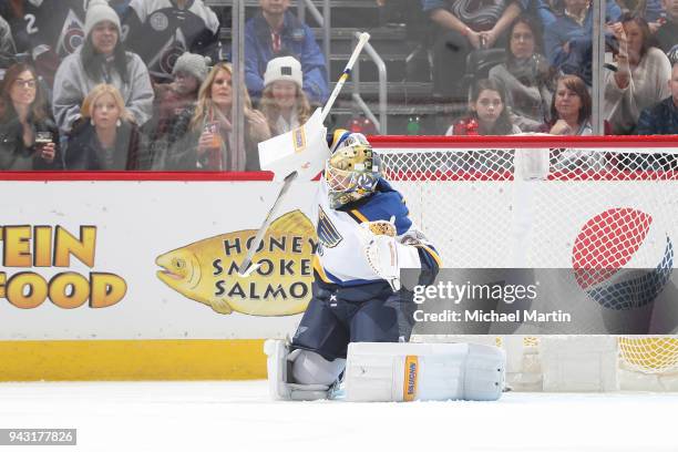 Goaltender Jake Allen of the St. Louis Blues deflects a shot by the Colorado Avalanche at the Pepsi Center on April 2018 in Denver, Colorado.