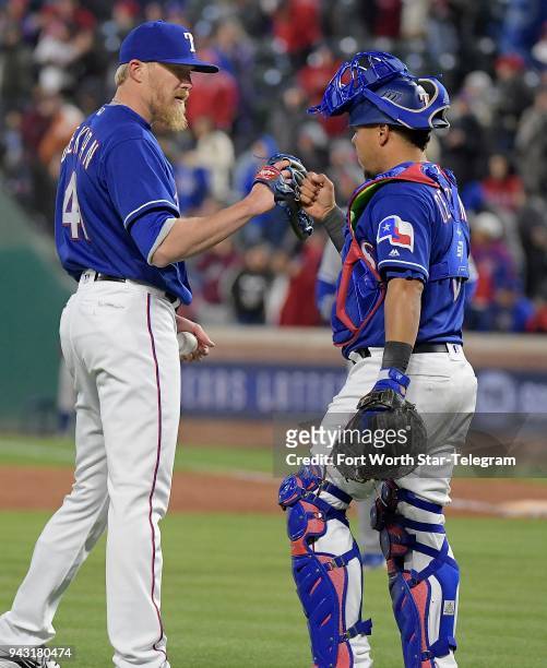 Texas Rangers relief pitcher Jake Diekman, left, fist-bumps catcher Juan Centeno after the final out in a 5-1 win against the Toronto Blue Jays at...