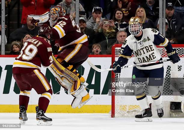 Hunter Shepard and Parker Mackay of the Minnesota-Duluth Bulldogs celebrate the win of the championship game of the 2018 NCAA Division I Men's Hockey...