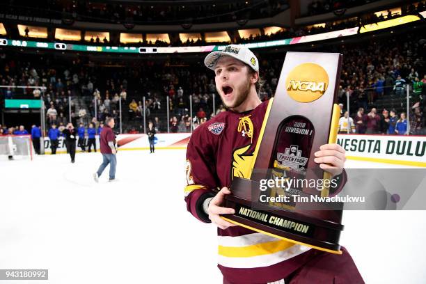 Jared Thomas of the Minnesota-Duluth Bulldogs celebrates their victory over the Notre Dame Fighting Irish during the Division I Men's Ice Hockey...