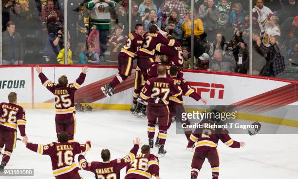 Hunter Shepard of the Minnesota Duluth Bulldogs celebrates with his teammates after the Bulldogs won the national championship against the Notre Dame...