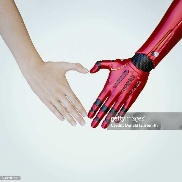 human and cyborg heart shape hands - robotic heart stock-fotos und bilder
