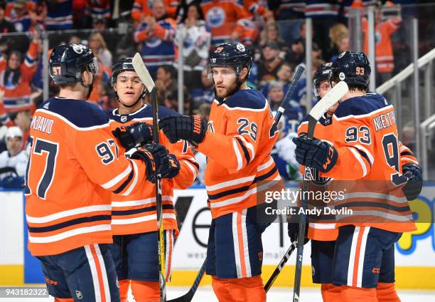 Leon Draisaitl, Connor McDavid, Ethan Bear, Ryan Nugent-Hopkins and Drake Caggiula of the Edmonton Oilers celebrate after a goal during the game...