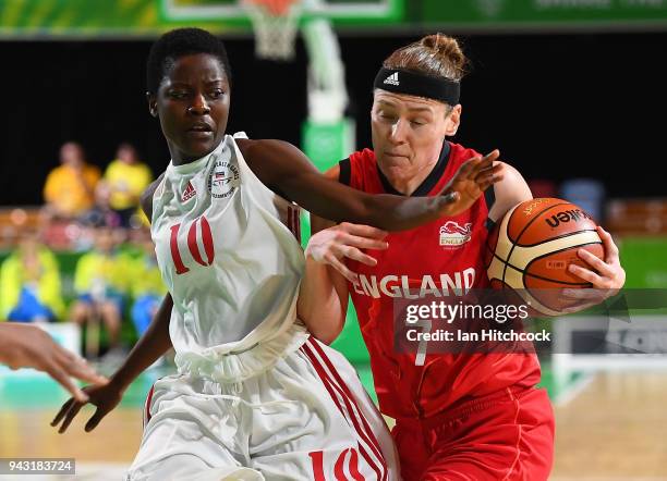 Rachael Vanderwal of England drives to the basket past Delma Zita of Mozambique during the Preliminary Basketball round match between Mozambique and...