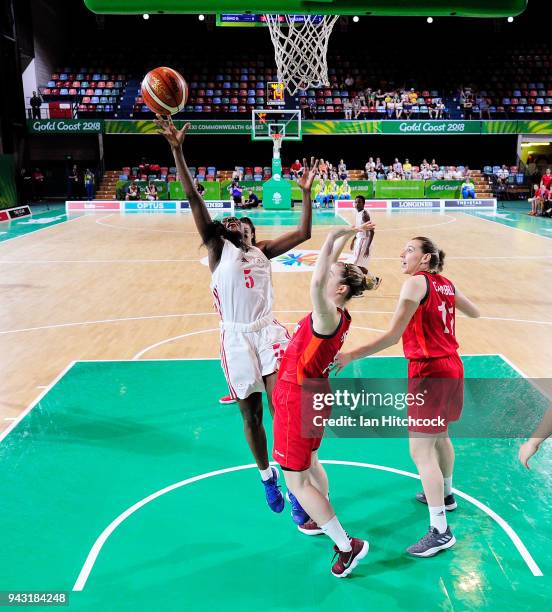 Dulce Mabjaia of Mozambique attempts a lay up during the Preliminary Basketball round match between Mozambique and England on day four of the Gold...