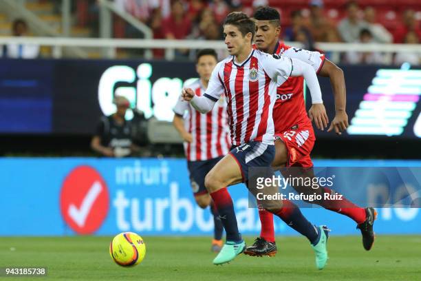 Isaac Brizuela of Chivas fights for the ball with Wilder Cartagena of Veracruz during the 14th round match between Chivas and Veracruz as part of the...