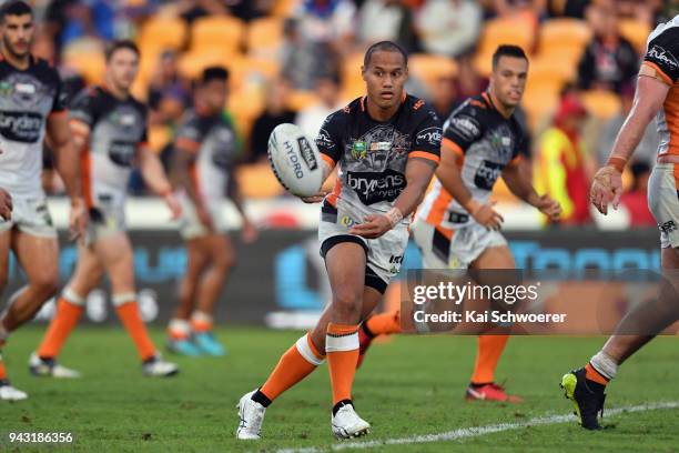 Pita Godinet of the Tigers passes the ball during the round five NRL match between the Wests Tigers and the Melbourne Storm at Mt Smart Stadium on...