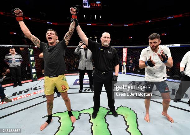 Renato Moicano of Brazil celebrates after his unanimous-decision victory over Calvin Kattar in their featherweight bout during the UFC 223 event...