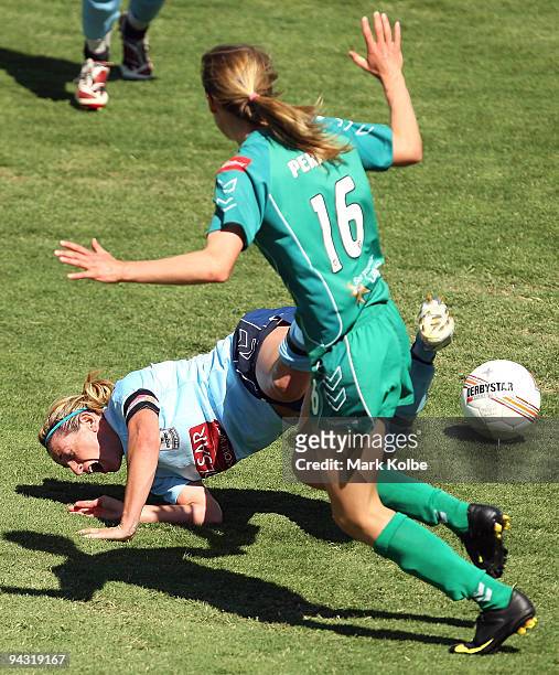 Heather Garriock of Sydney FC is fouled by Ellyse Perry of Canberra United during the W-League Semi Final match between Sydney FC and Canberra United...