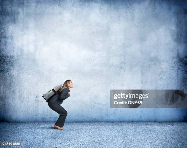 businesswoman with rocket strapped to her back - challenge launch stock pictures, royalty-free photos & images