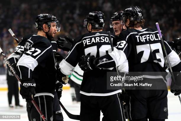 Tanner Pearson and Tyler Toffoli congratulate Alec Martinez of the Los Angeles Kings on his goal during the second period of a game against the...