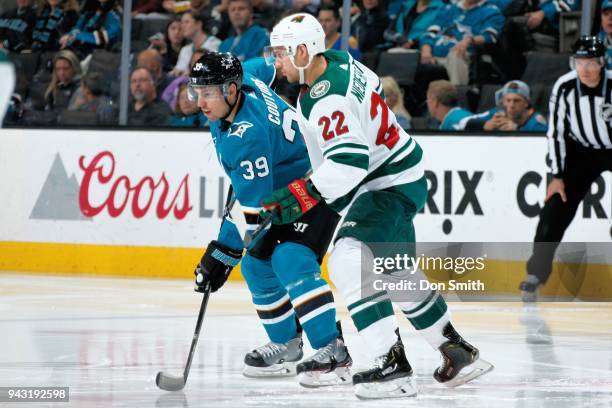 Logan Couture of the San Jose Sharks and Nino Niederreiter of the Minnesota Wild get ready at SAP Center on April 7, 2018 in San Jose, California.