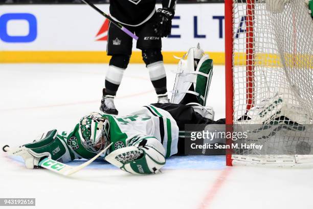 Kari Lehtonen of the Dallas Stars falls trying to block a goal by Alec Martinez of the Los Angeles Kings during the second period of a game at...