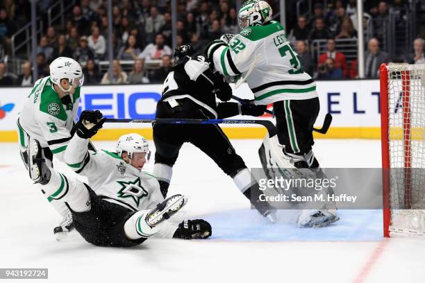 Kari Lehtonen, Esa Lindell, and John Klingberg of the Dallas Stars defend against Adrian Kempe of the Los Angeles Kings during the second period of a...