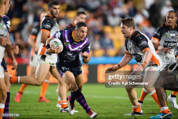 Billy Slater of the Storm charges forward during the round five NRL match between the Wests Tigers and the Melbourne Storm at Mt Smart Stadium on...