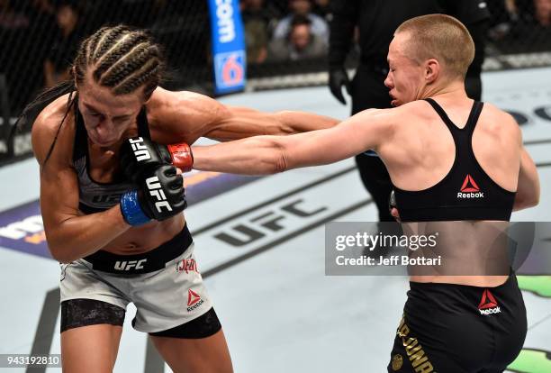 Rose Namajunas punches Joanna Jedrzejczyk of Poland in their women's strawweight title bout during the UFC 223 event inside Barclays Center on April...