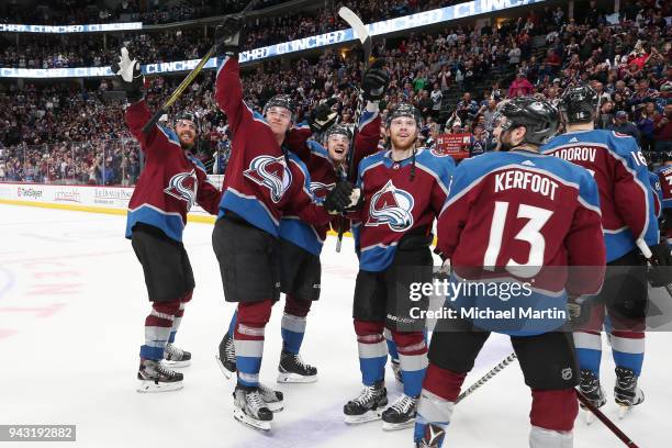 Patrik Nemeth, Mikko Rantanen, Tyson Jost and J.T. Compher of the Colorado Avalanche wave to the crowd after a win against the St. Louis Blues at the...